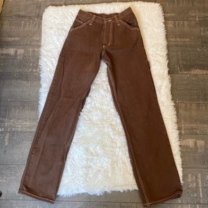 Brown carpenter pants with white stitching. (Brandy Melville)